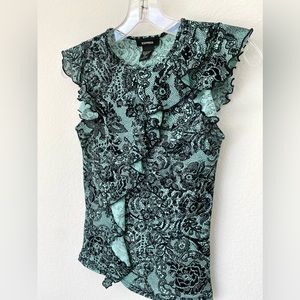 Teen’s net pattern knit top with feminine flutter sleeves and front.